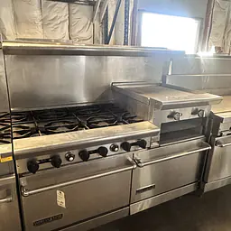 American range 6 Burner , Griddle , and two Ovens Natural Gas - Master